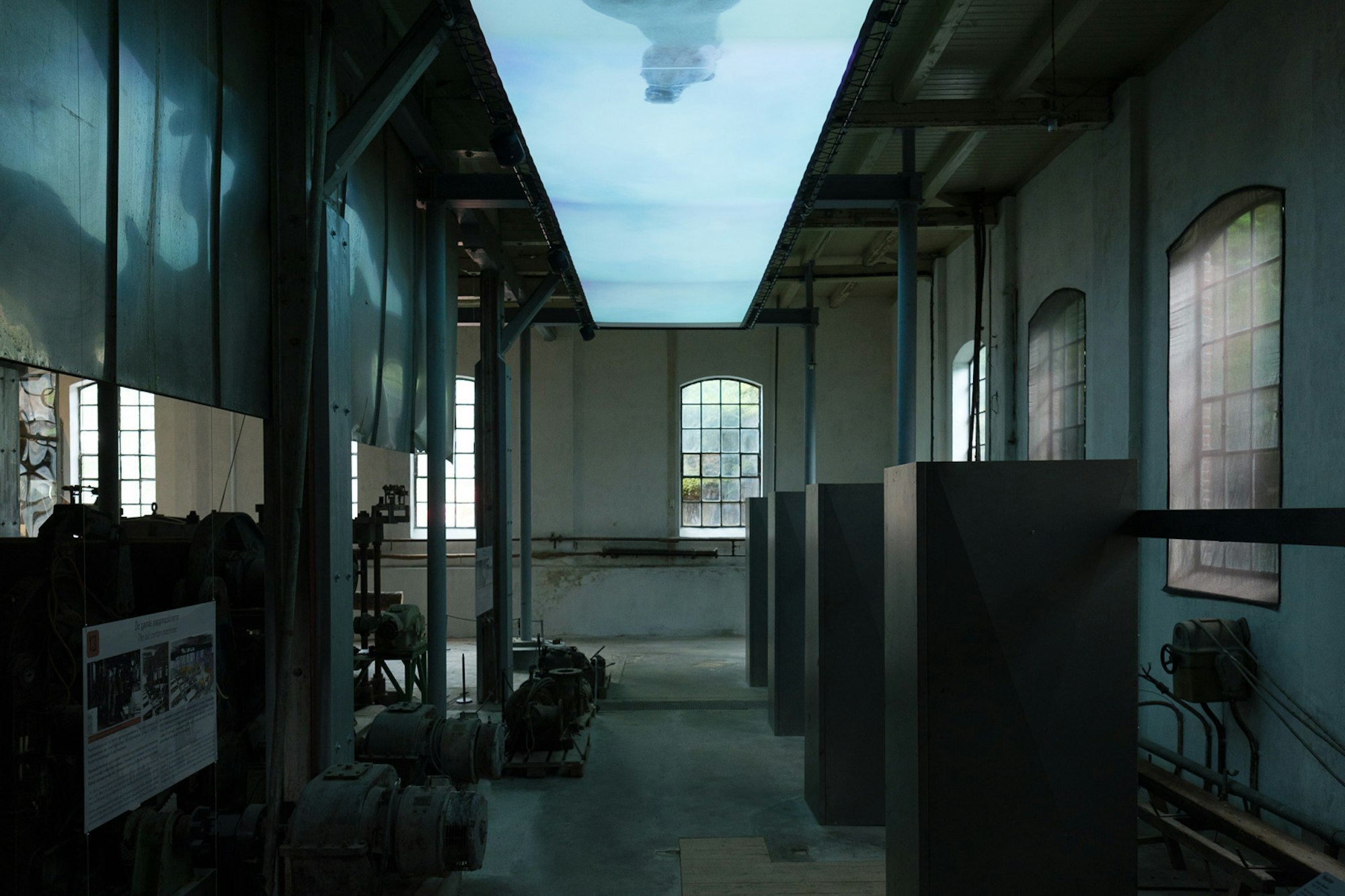 A video installation placed in the ceiling showing a horse running from underneath.