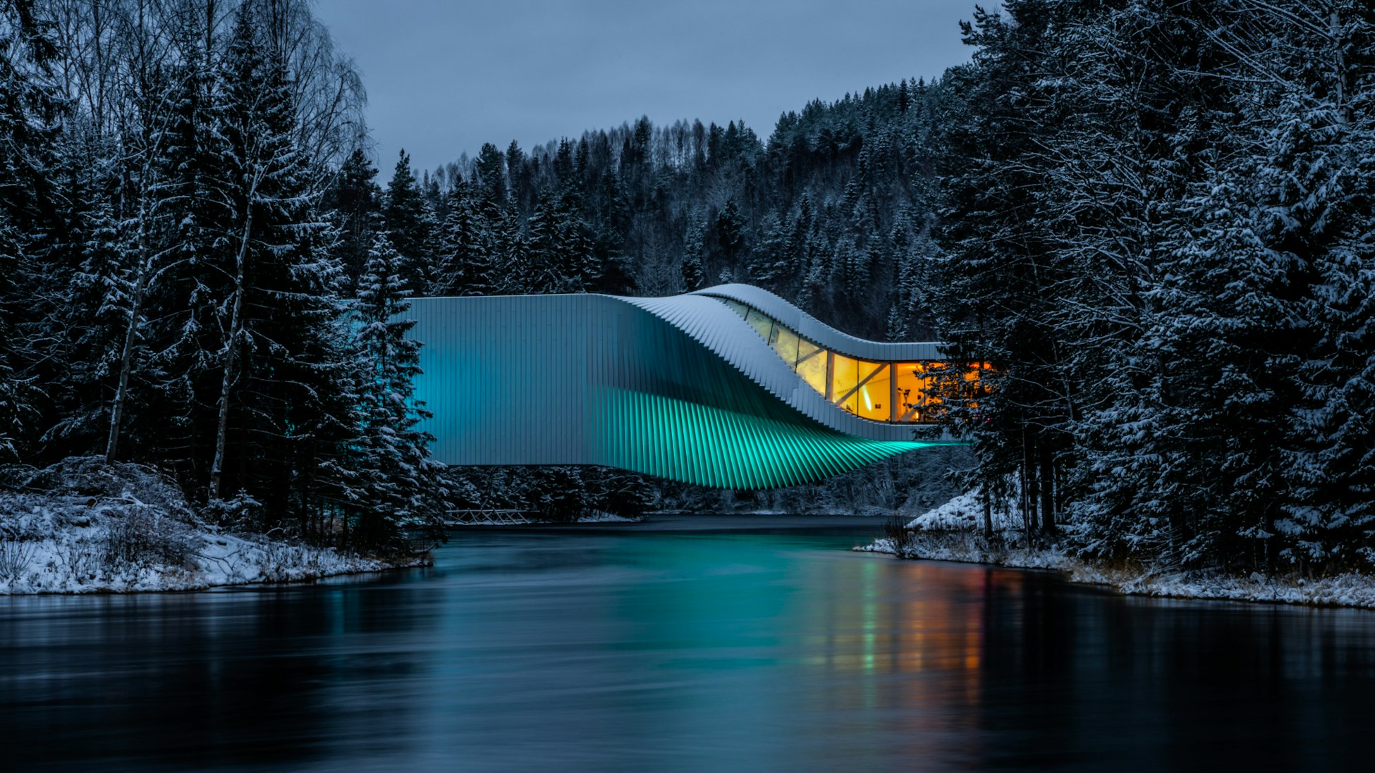 The Twist, a museum building that is also a bridge over the Randselva river. Dramatic image.
